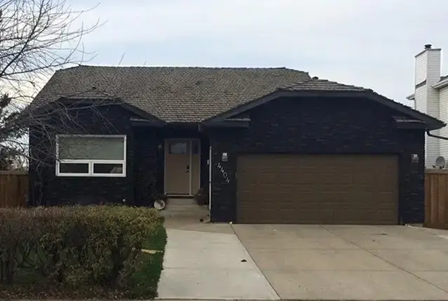 residential one story dark brown house