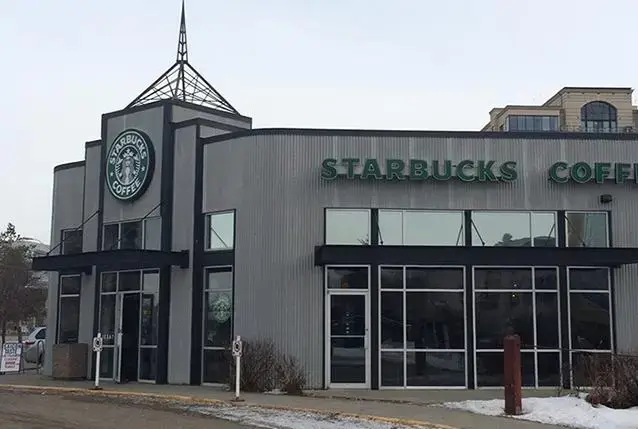 Exterior commercial painting project in Edmonton on a retail Starbucks storefront.