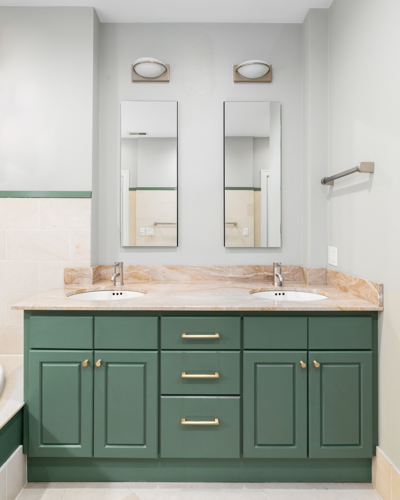 A bathroom cabinet green paint finish